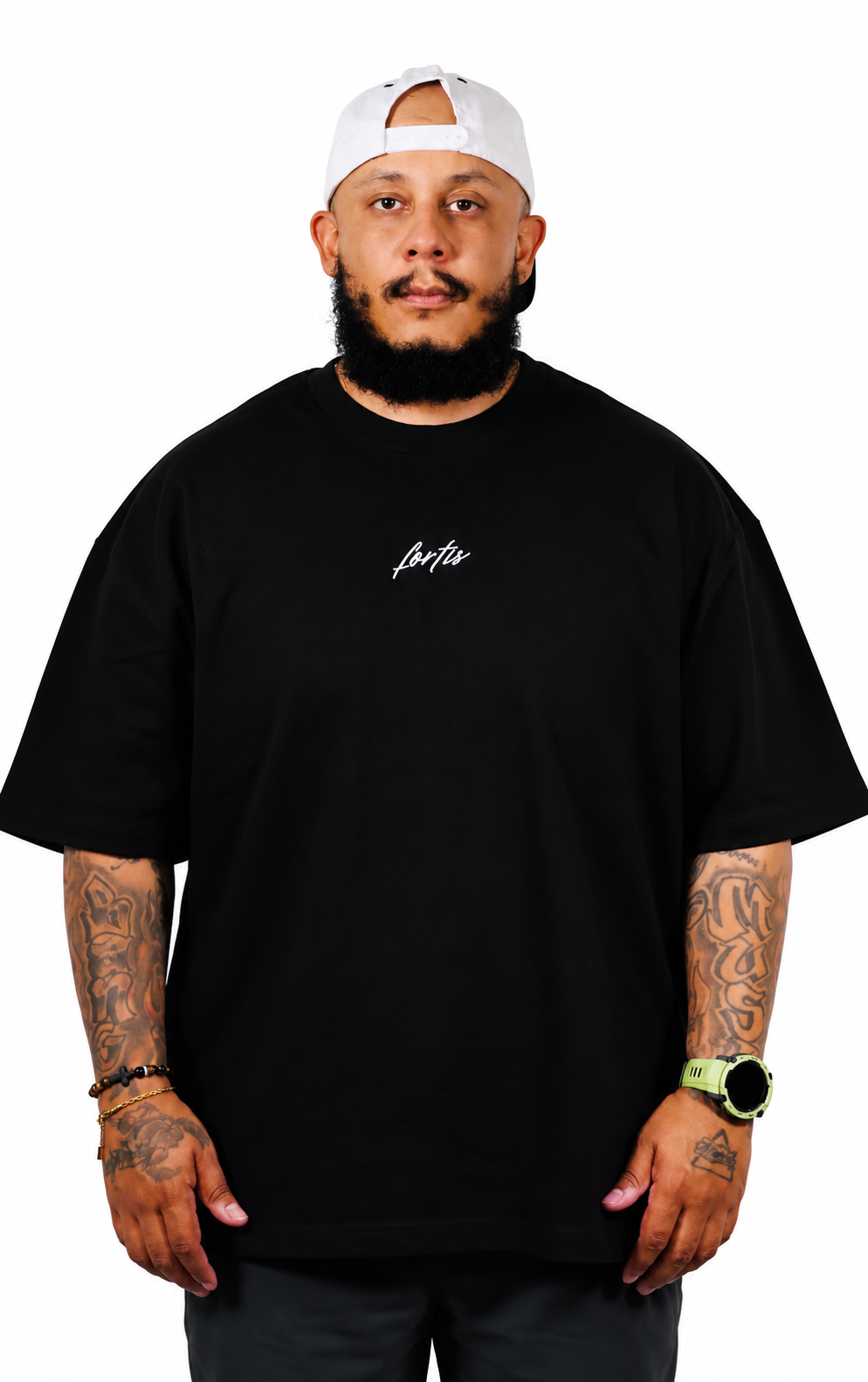 Front view of the black Fortis Oversized Essential T with white chest script.