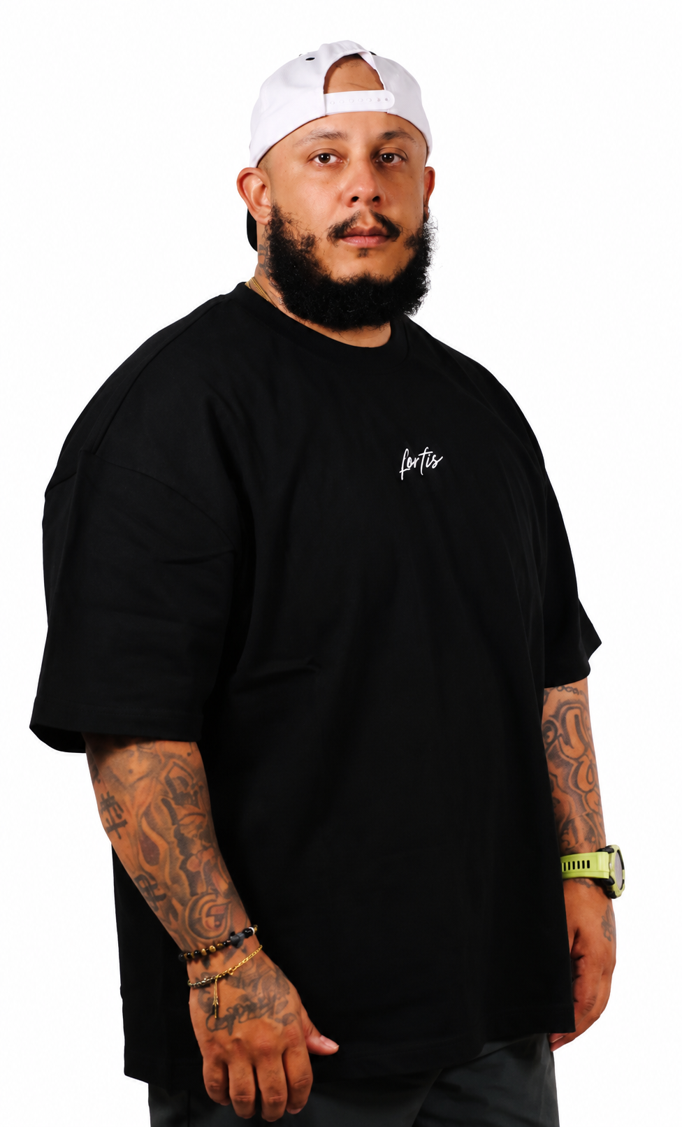 Angled view of the black Fortis Oversized Essential T showing its oversized fit.