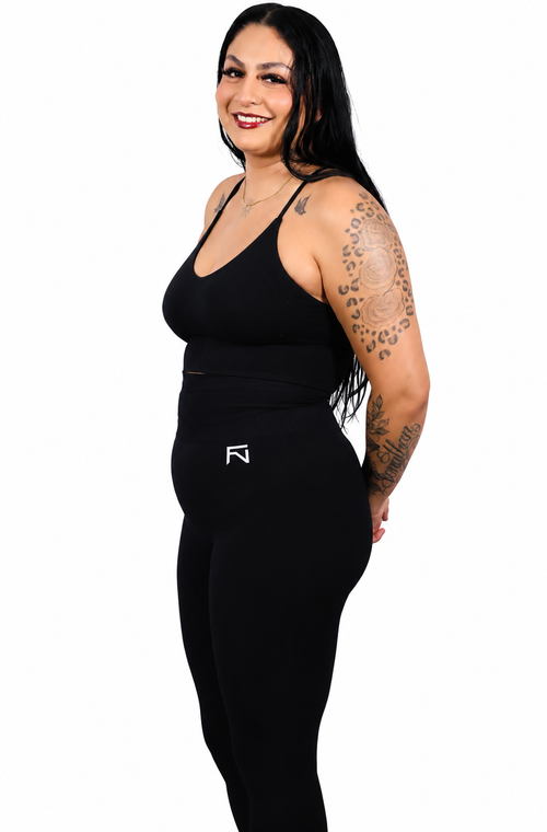 Angled view of black Fortis (BG) leggings.