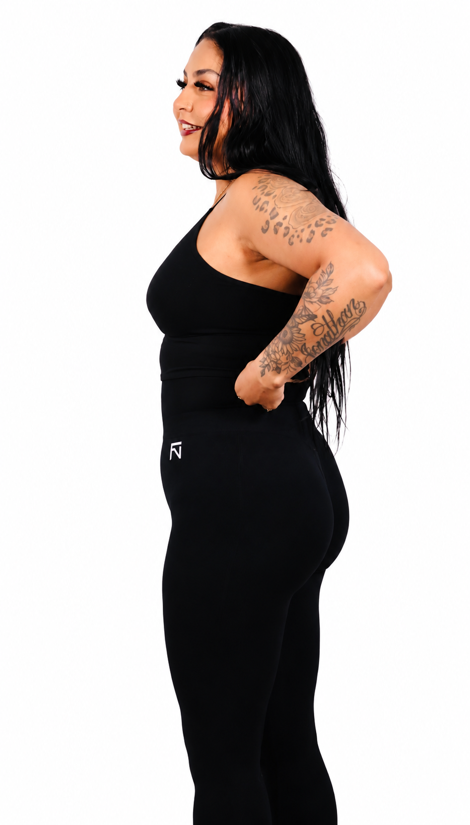 Side view of black Fortis (BG) leggings showing the high waistband.
